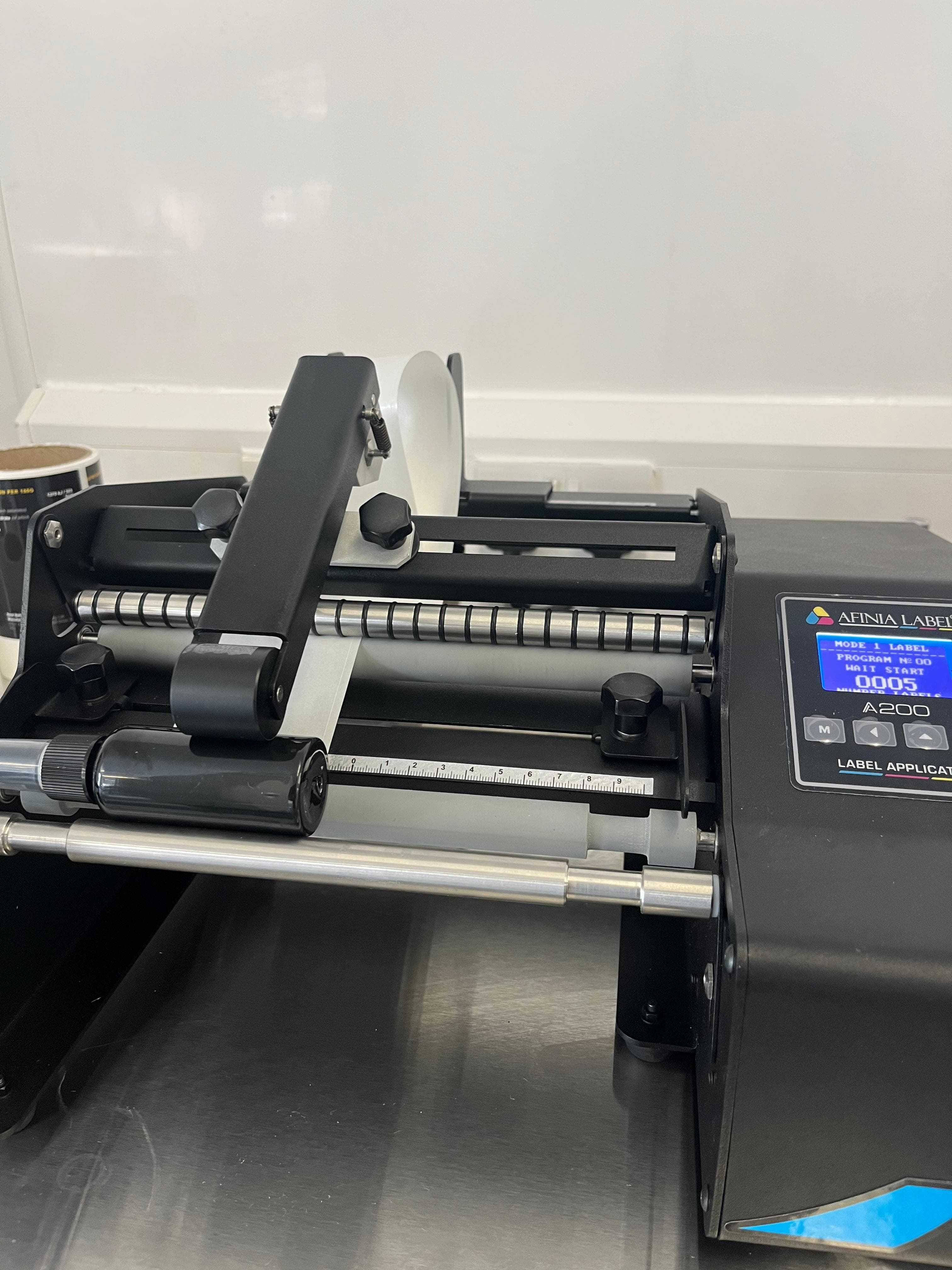 Bottle labelling applicator with CIJ batch coding on the line.