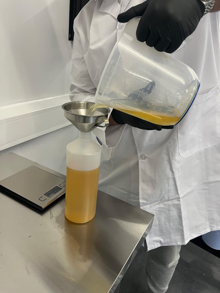 Liquid product poured during filling preparation in the lab.