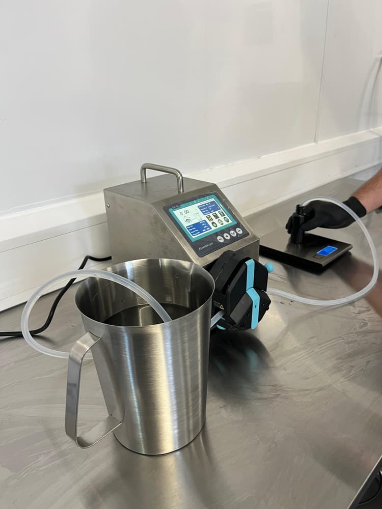 Lab vessel with transfer pump moving product toward the next process step.