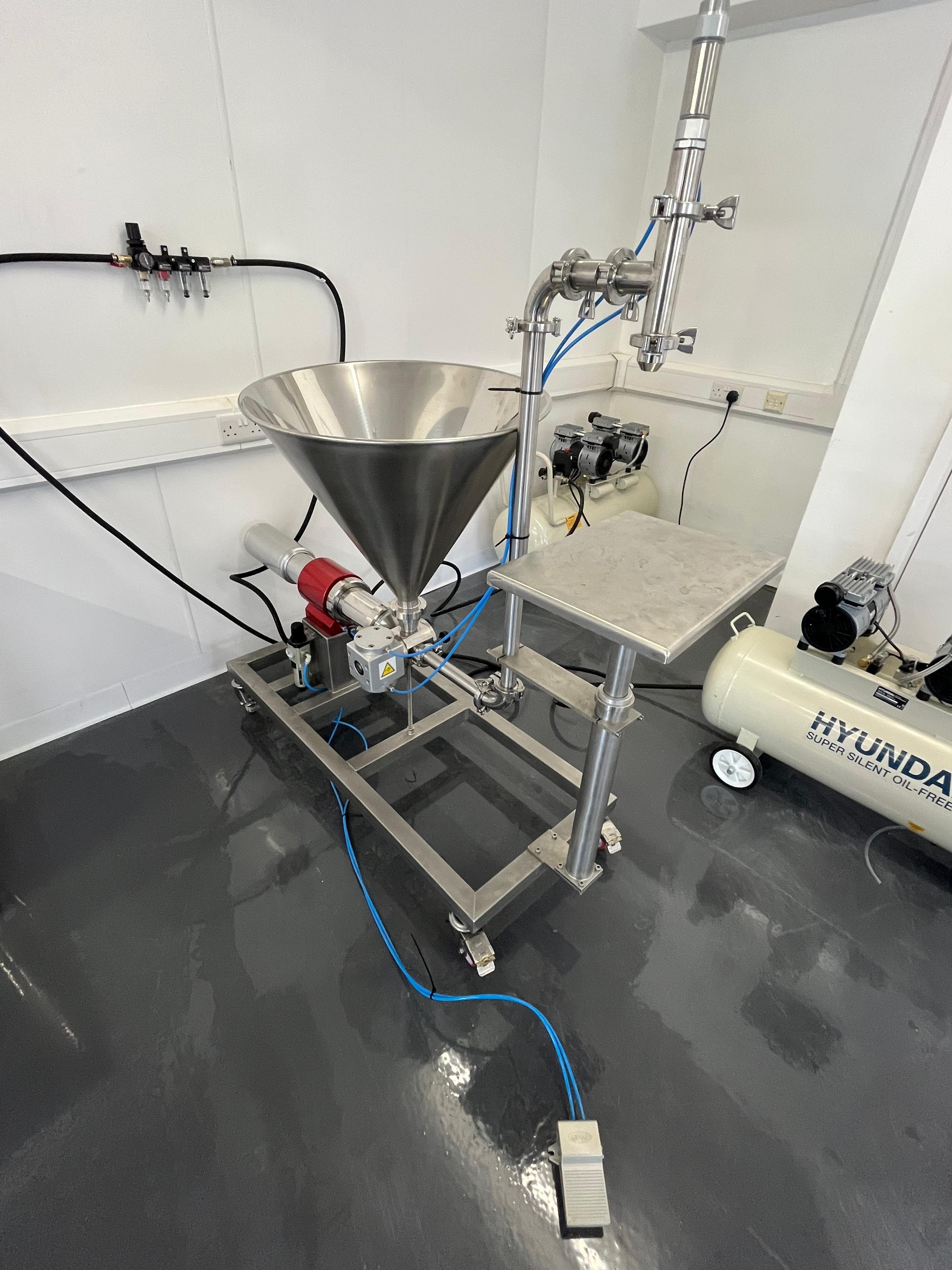 Transfer pump and lab vessel used in the contract manufacturing workflow.