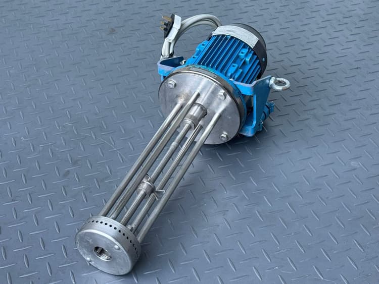 Precision fill nozzle assembly staged for a production changeover.