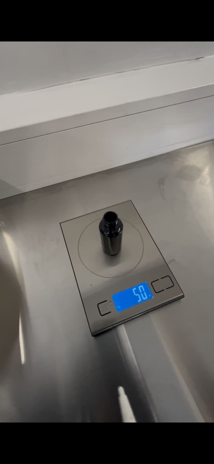 QC scale check verifying fill accuracy against the batch record.